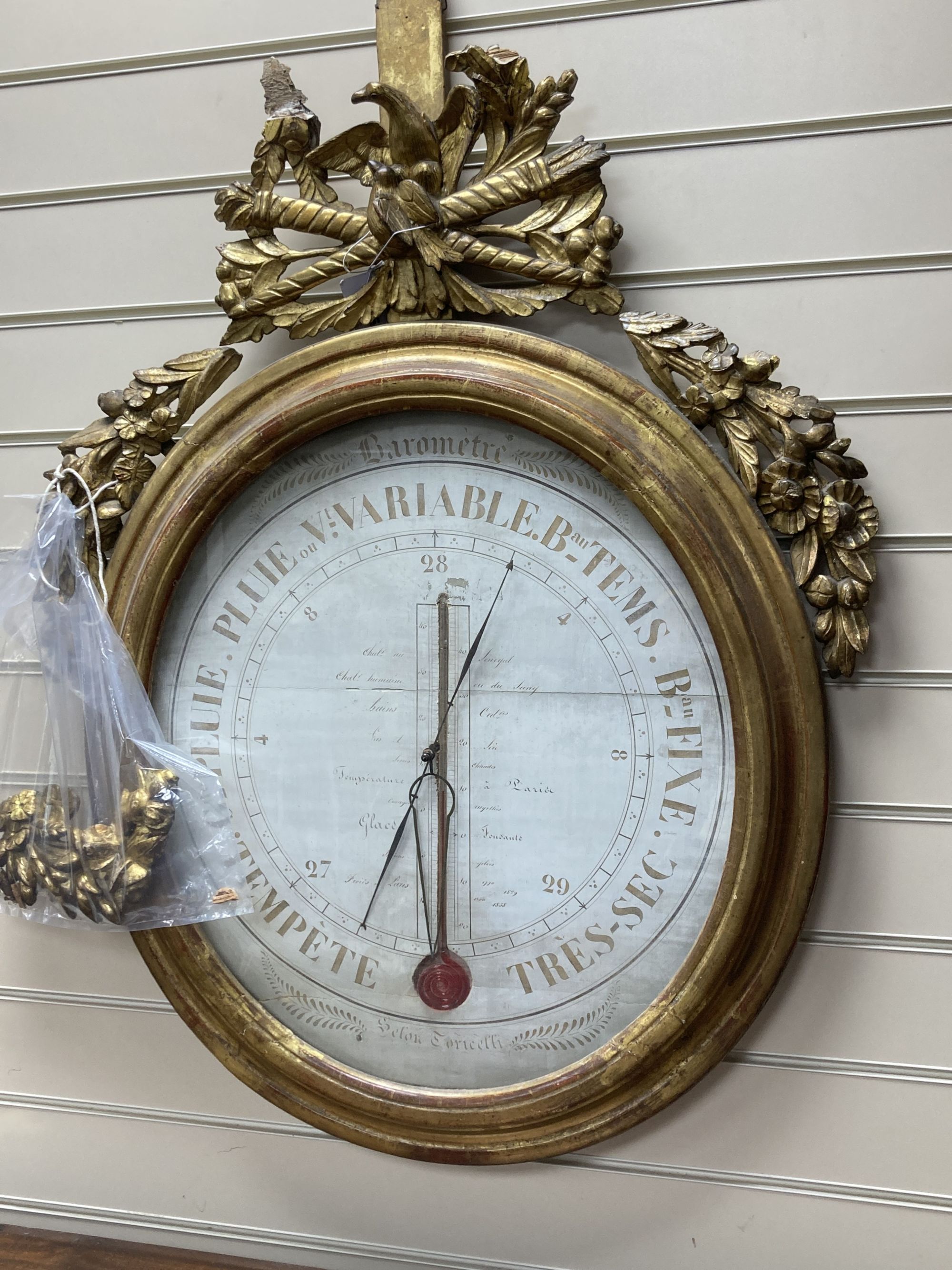 A 19th century French carved giltwood barometer / thermometer, width 68cm, height 92cm